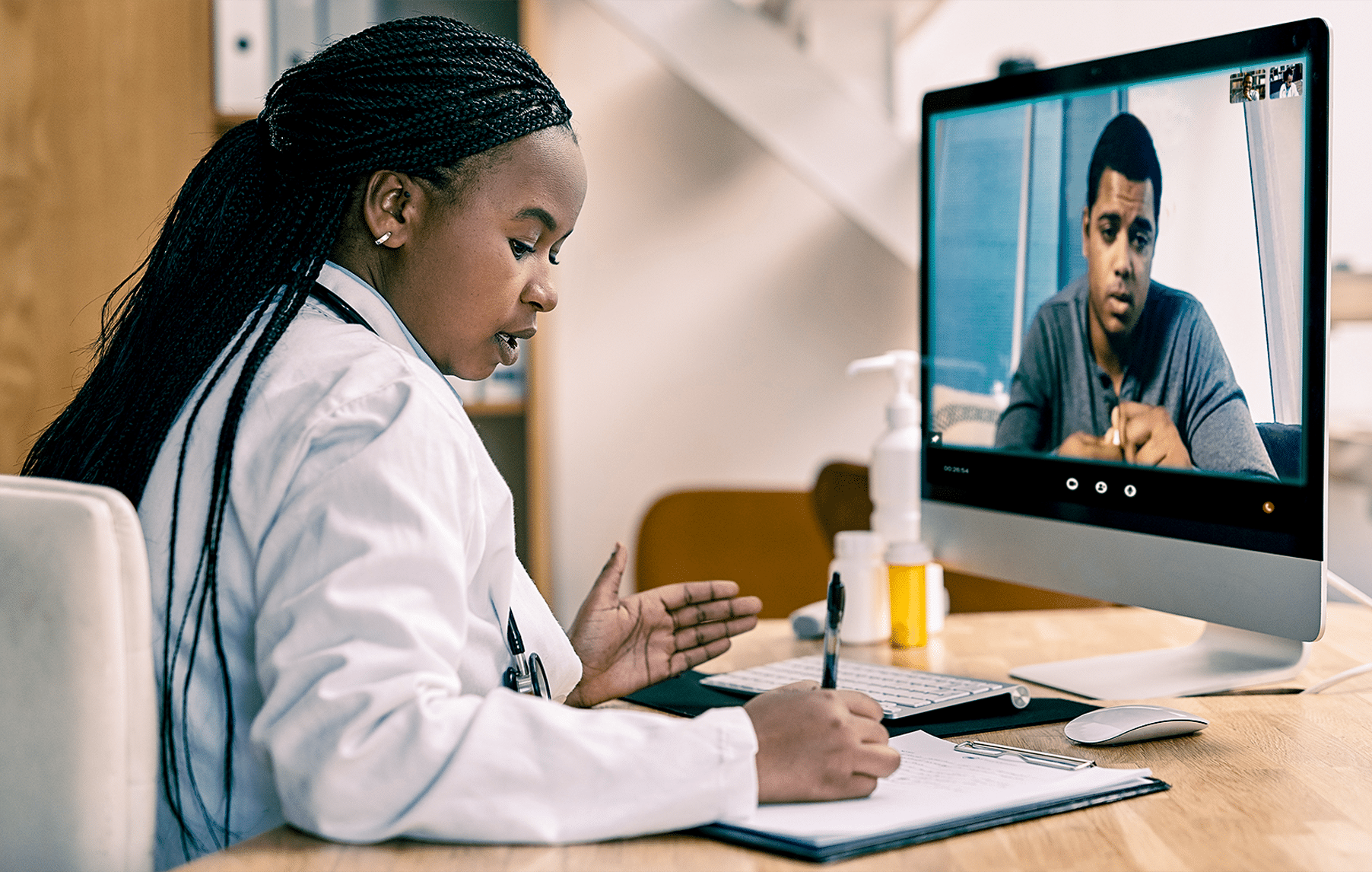 doctor on video call through EHR system with patient and interpreter